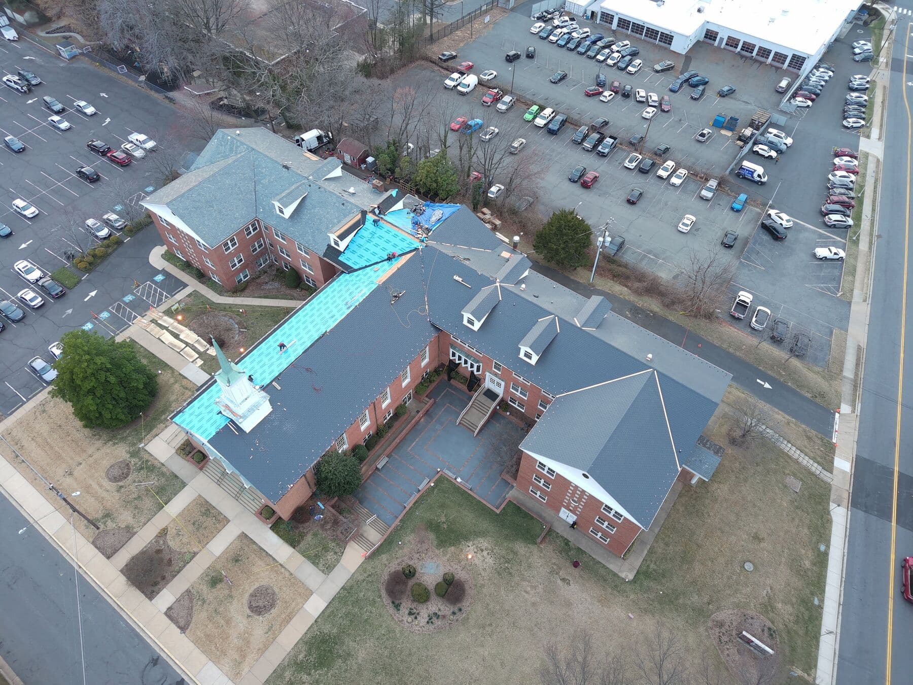 Aerial view of a large commercial re-roofing project in progress