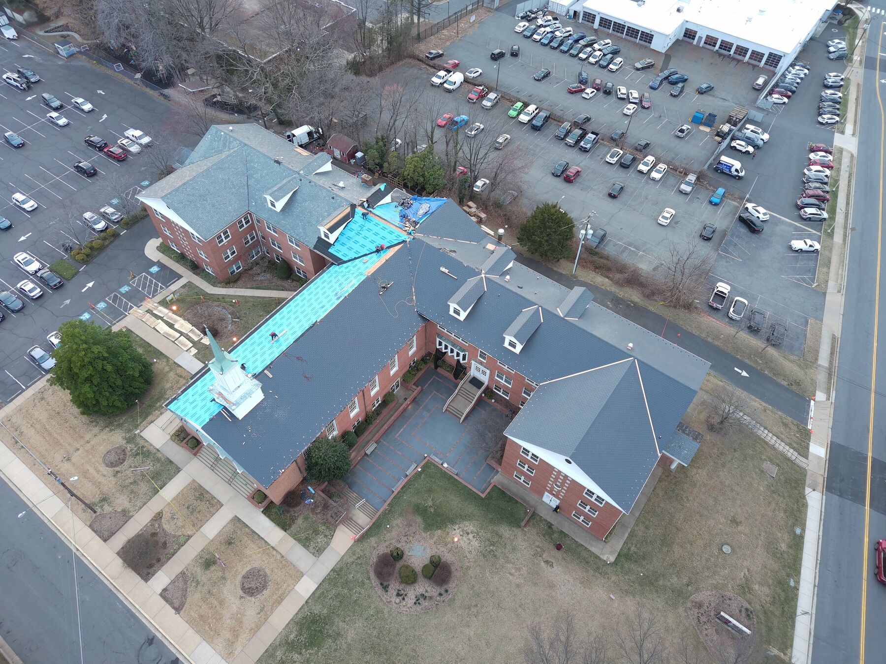 Aerial view of a large commercial re-roofing project in progress