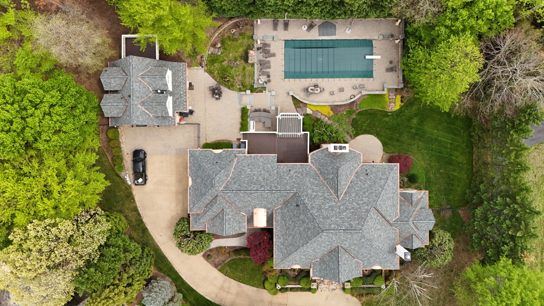 Aerial view of an estate with a complete designer asphalt shingle roof system